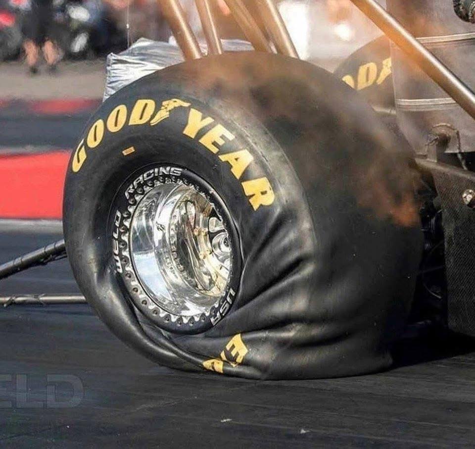 top fuel acceleration on a dragster tire