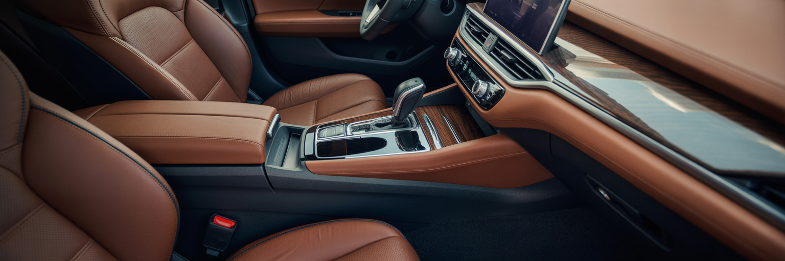 Close-up of luxury car interior with leather and wood trim.