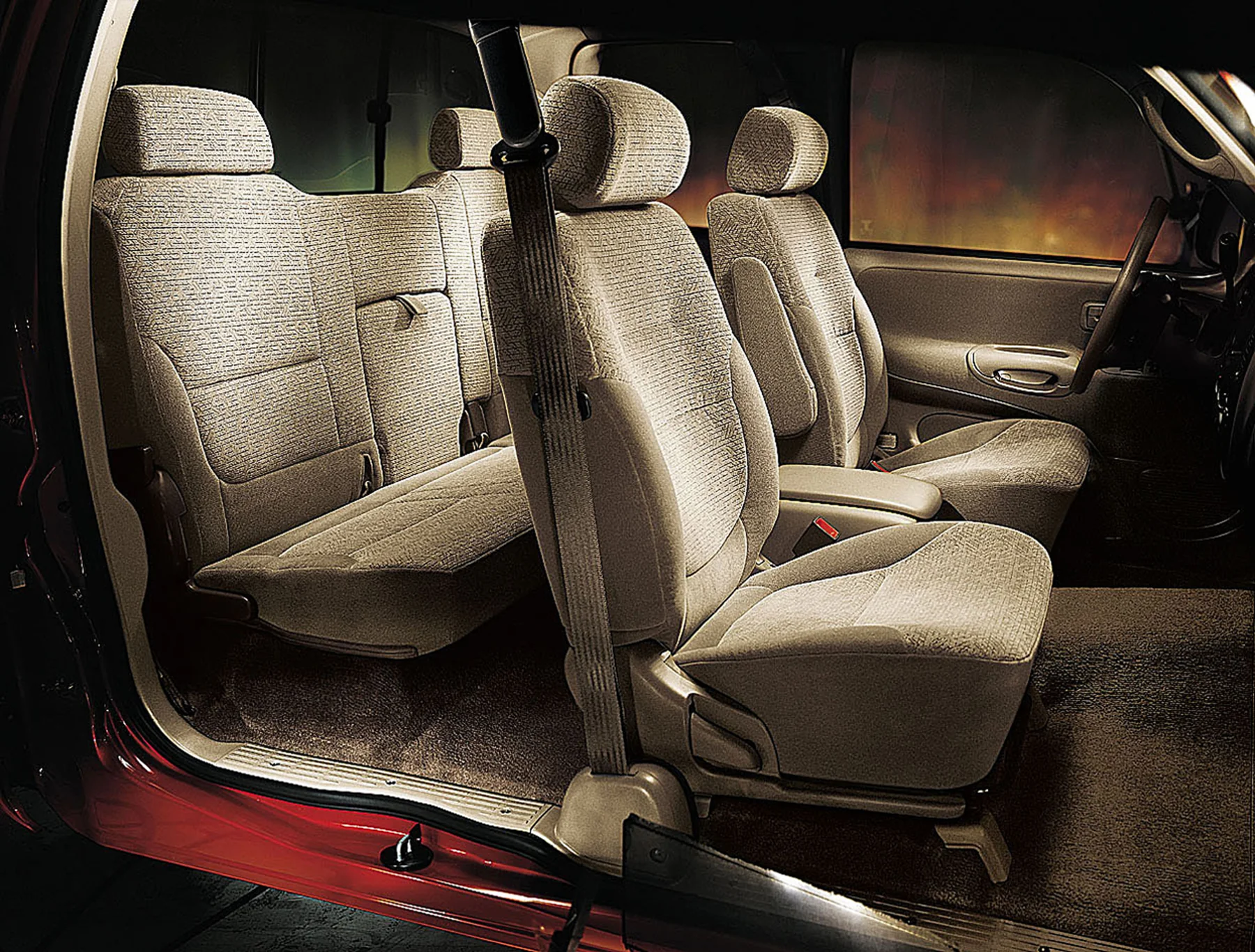 Cloth front seats and rear bench inside a 2000 Toyota Tundra Access Cab.