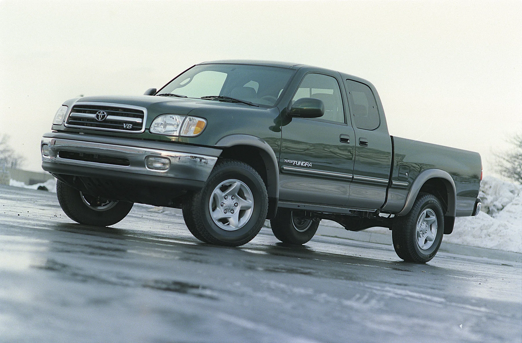 2000 Toyota Tundra driving on a snow-covered road.